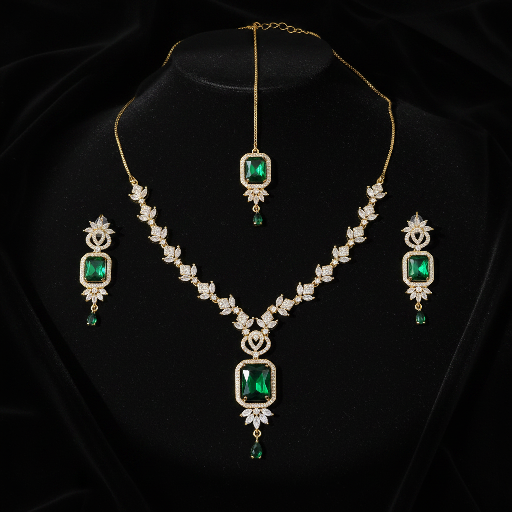 Gold emerald green bridal jewelry set with maang tikka on dark luxury background