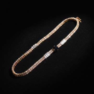 Gold double row crystal bracelet with black square center stone on dark luxury background
