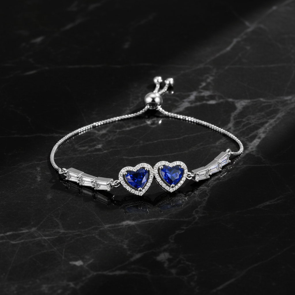 Silver double blue sapphire heart bracelet on dark luxury background