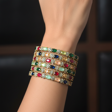 Multicolor oval gemstone gold bangle set worn on wrist