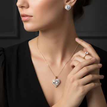 Gold crystal heart necklace ring and earrings jewelry set worn together