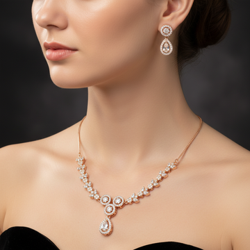 Rose gold pavé crystal floral necklace and earring set worn on neck and ears