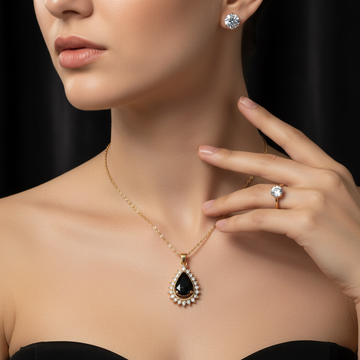 Gold black teardrop necklace ring and earrings jewelry set worn together