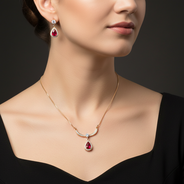 Gold ruby teardrop necklace and earring set worn on neck and ears